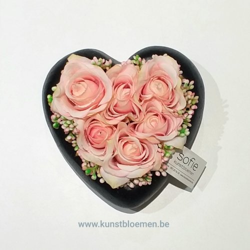 Roze roosjes in stone-hartje